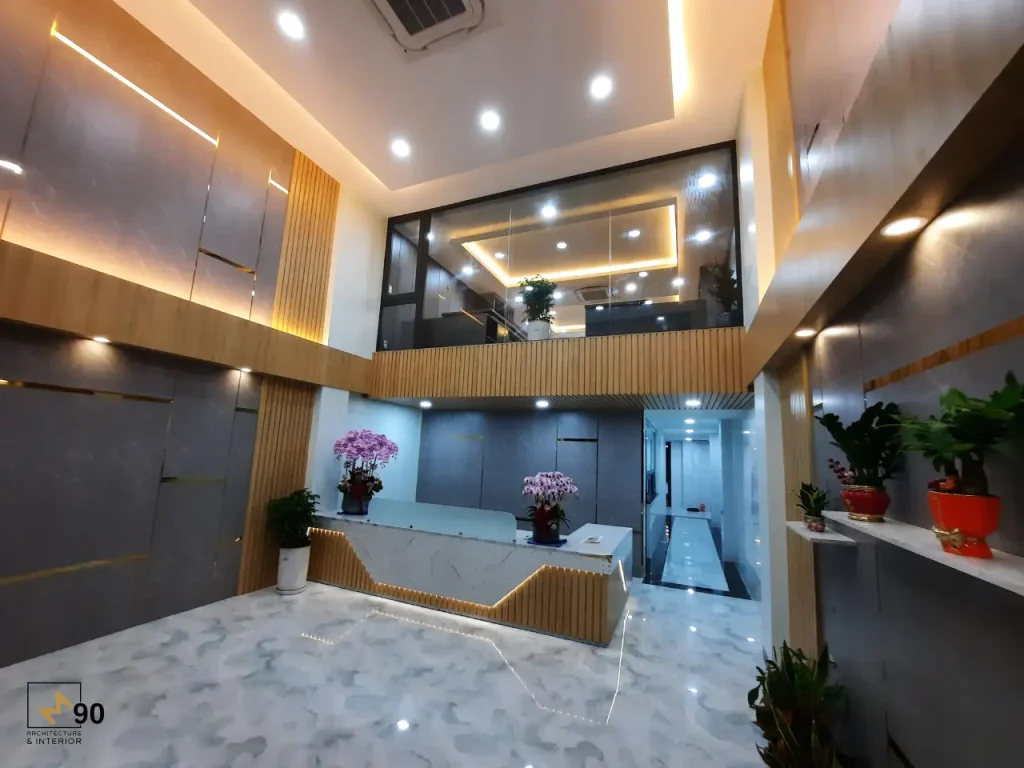 Không gian sảnh lễ tân văn phòng đẹp với thiết kế mở và ánh sáng ấm